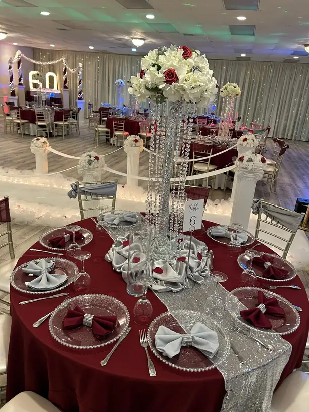 A 60th birthday in burgundy and silver with tall crystal centerpieces